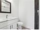 Modern bathroom featuring a white vanity, rectangular mirror, and black subway tile in the shower at 9089 Hanover St, Lithia Springs, GA 30122