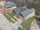 Beautiful new construction home with stone accents, a gray roof, and professional landscaping on a corner lot at 9089 Hanover St, Lithia Springs, GA 30122
