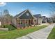 An exterior showcasing the home's architectural style and well-maintained landscaping at 9089 Hanover St, Lithia Springs, GA 30122