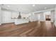 Bright, open-concept kitchen with a large island, wood floors, and plenty of storage space at 9089 Hanover St, Lithia Springs, GA 30122