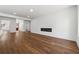 Spacious living room with hardwood floors, white walls, fireplace and an open floor plan at 9089 Hanover St, Lithia Springs, GA 30122