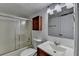 A bathroom featuring a vanity, a toilet, and a shower with glass doors at 933 Carla Pl, Norcross, GA 30093