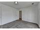 Bedroom with neutral carpeting and light, bright walls at 933 Carla Pl, Norcross, GA 30093