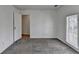 Cozy bedroom with plush carpeting and doorway to a large closet at 933 Carla Pl, Norcross, GA 30093
