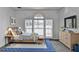 Staged primary bedroom with an abundance of natural light and modern furniture at 933 Carla Pl, Norcross, GA 30093