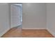 Cozy bedroom with hardwood flooring and a view into the open doorway at 933 Carla Pl, Norcross, GA 30093