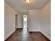 A bedroom with laminate floors and access to a small bathroom at 933 Carla Pl, Norcross, GA 30093