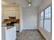 View of dining area looking into kitchen area featuring tile floors and bright, natural light at 933 Carla Pl, Norcross, GA 30093