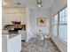 Dining area features tile floors, modern ceiling fan and room for table and chairs at 933 Carla Pl, Norcross, GA 30093