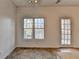 The dining area features a tile floor, natural lighting, and a rear exit at 933 Carla Pl, Norcross, GA 30093