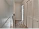 The hallway has a carpet floor and a closet with louvered doors at 933 Carla Pl, Norcross, GA 30093