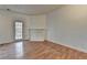 Bright living room with hardwood floors, a decorative fireplace, and a door leading to the outside at 933 Carla Pl, Norcross, GA 30093