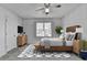 This main bedroom is fully furnished with natural lighting and carpet at 933 Carla Pl, Norcross, GA 30093