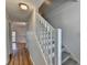 Well-lit staircase with modern railing, providing access to the upper floors of the home at 933 Carla Pl, Norcross, GA 30093