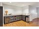 Basement bar with gray cabinets, granite counters, and stainless steel appliances at 1898 Woodland Hills Nw Ave, Atlanta, GA 30318