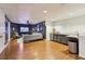 Finished basement area featuring a living space, bar, and laminate floors at 1898 Woodland Hills Nw Ave, Atlanta, GA 30318