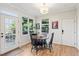 Charming breakfast nook with a round table, wooden chairs, and multiple windows offering natural light at 1898 Woodland Hills Nw Ave, Atlanta, GA 30318