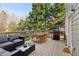 Wooden deck featuring outdoor furniture and a grill, perfect for entertaining at 1898 Woodland Hills Nw Ave, Atlanta, GA 30318