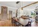 Open concept dining room with hardwood floors and view to living room at 1898 Woodland Hills Nw Ave, Atlanta, GA 30318