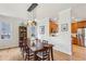 Elegant dining room featuring a modern light fixture and view to the kitchen at 1898 Woodland Hills Nw Ave, Atlanta, GA 30318