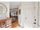 Bright foyer with hardwood floors, view to dining room and exposed wooden beam at 1898 Woodland Hills Nw Ave, Atlanta, GA 30318