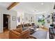 Open concept living room with hardwood floors and seamless flow to other living spaces at 1898 Woodland Hills Nw Ave, Atlanta, GA 30318