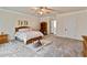 Bright bedroom featuring a comfortable bed, soft carpet, and ample space at 2634 Greenes Ln, Powder Springs, GA 30127