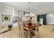 Dining area with seating for six, modern lighting, and views to the living room at 2634 Greenes Ln, Powder Springs, GA 30127