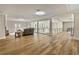 Bright living room showcasing hardwood floors, cozy seating, and natural light at 2634 Greenes Ln, Powder Springs, GA 30127