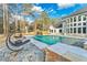 Stunning backyard oasis featuring a waterfall, swimming pool, and lounge chairs at 2634 Greenes Ln, Powder Springs, GA 30127