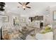 Living room with a fireplace, open to the kitchen, featuring modern decor and hardwood floors at 2720 Ravencliff Dr, Austell, GA 30168