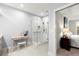 Elegant bathroom with glass-enclosed shower, marble walls, and a convenient vanity area at 913 Thornington Pl, Roswell, GA 30075