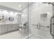 Bright bathroom with dual vanities, a glass shower, and modern design elements for a spa-like experience at 913 Thornington Pl, Roswell, GA 30075