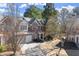 Charming two-story brick home with well-maintained landscaping and a two-car garage at 913 Thornington Pl, Roswell, GA 30075