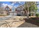 Charming brick townhome featuring a two-car garage and landscaped front yard at 913 Thornington Pl, Roswell, GA 30075