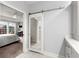 Hallway leading to the main bedroom, featuring a sliding mirrored door and built-in cabinetry at 913 Thornington Pl, Roswell, GA 30075