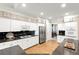 Spacious kitchen featuring granite countertops, stainless steel appliances, and ample cabinet space at 913 Thornington Pl, Roswell, GA 30075