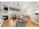 Inviting living room with fireplace, large windows, and comfortable seating arrangement at 913 Thornington Pl, Roswell, GA 30075