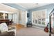 Bright living room with plantation shutters, comfortable seating and elegant decor at 913 Thornington Pl, Roswell, GA 30075