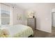 Bright bedroom showcasing a neutral color scheme, window with curtains, and light wood dresser with decor at 1265 Elowen Dr, Austell, GA 30168