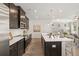 Modern kitchen with stainless steel appliances, white countertops, and an open layout to the living area at 1265 Elowen Dr, Austell, GA 30168