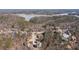 An aerial view shows homes nestled in a wooded area with a view of the lake in the distance at 15 York Trce, Cartersville, GA 30121