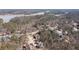 Expansive aerial view of the neighborhood with stunning lake backdrop and lush trees at 15 York Trce, Cartersville, GA 30121