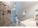 Modern bathroom featuring a glass-enclosed shower, stone tile, and stylish vanity at 15 York Trce, Cartersville, GA 30121