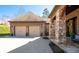 Close-up view of the brick and stone exterior with attached two-car garage at 15 York Trce, Cartersville, GA 30121