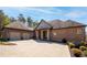 Attractive brick home with multi-car garage, stone columns, and manicured landscape beds at 15 York Trce, Cartersville, GA 30121