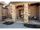 Inviting front porch featuring stone pillars, brick accents, and stylish seating at 15 York Trce, Cartersville, GA 30121