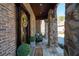 Close-up of the covered front porch with stone pillars, brick, and decorative wreath at 15 York Trce, Cartersville, GA 30121