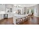 Bright, white kitchen with a center island, stainless steel appliances, and hardwood flooring at 15 York Trce, Cartersville, GA 30121