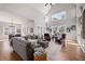 Spacious living room with soaring ceilings, large windows, and a dining area nearby at 15 York Trce, Cartersville, GA 30121